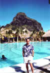 At ther pool of hotel Le Paradis; background: the famous Le Morne Brabant rock